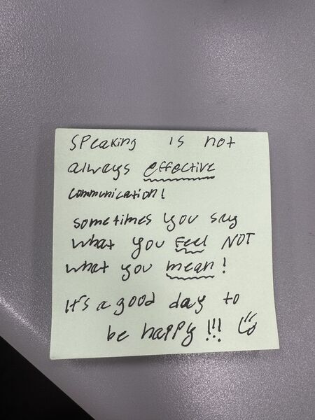 Handwritten sticky note with words of encouragement